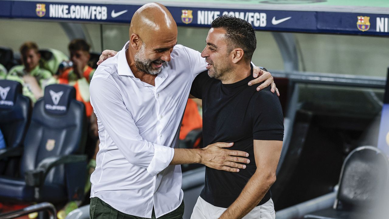 220826115948-02-pep-guardiola-xavi